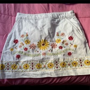 White denim skirt with floral embroidery